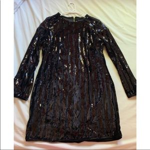 Brand New with tags Black sequined dress .